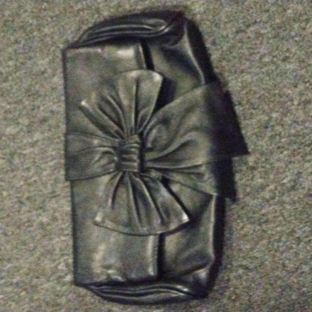 Felix Rey bow front flap clutch